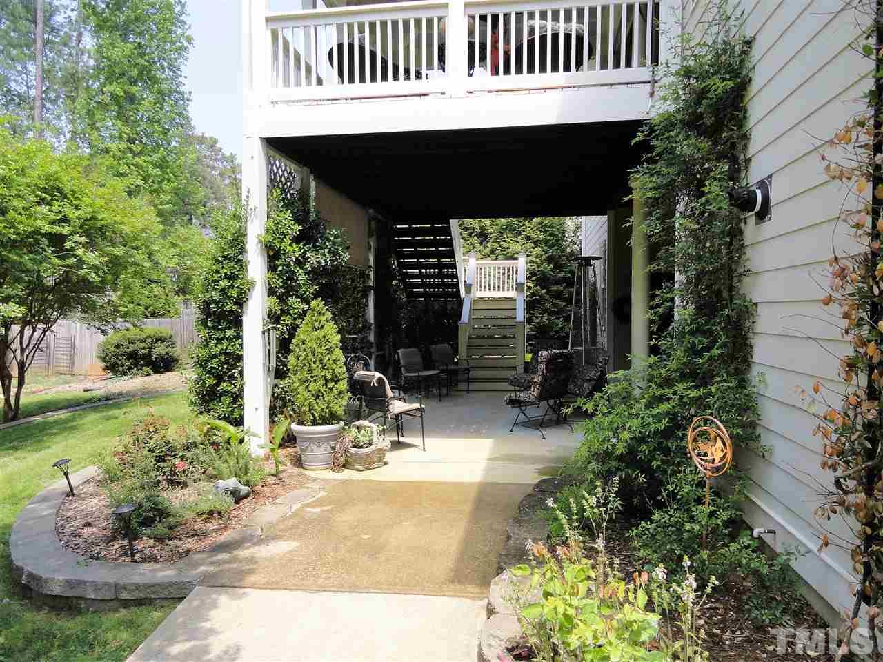 1004 Tyrrell Road Raleigh, NC 27609 - Photo 5 of 25 Covered patio off finished basement overlooking fenced in back yard!!!