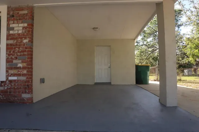 a view of a living room that has a large window