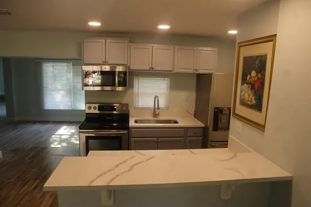 a view of hallway with wooden floor