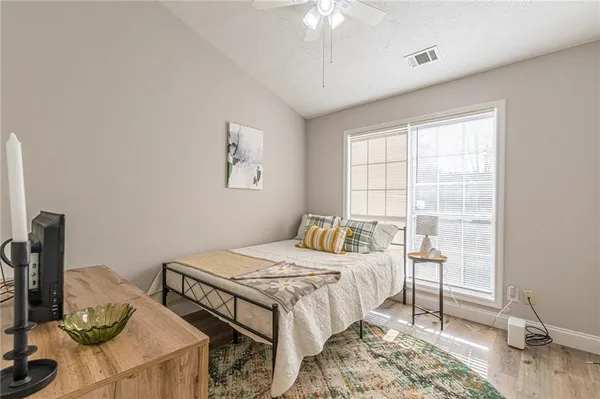 a bedroom that has a bed and a table in it