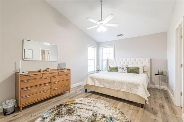 a bedroom with a bed and window