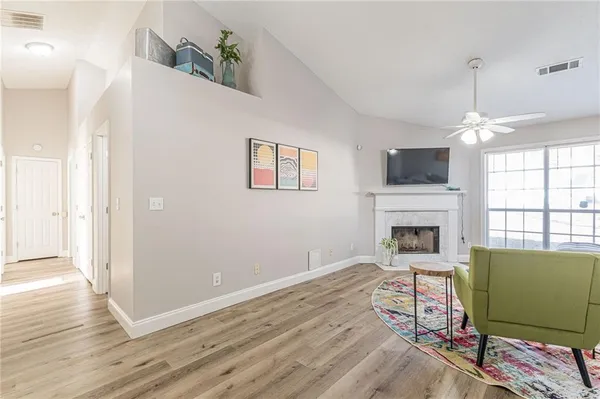 a living room with furniture and a fireplace