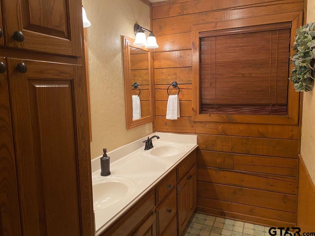 1765 Crabapple Road Gilmer, TX 75645 - Photo 11 of 29 a bathroom with a sink and a mirror