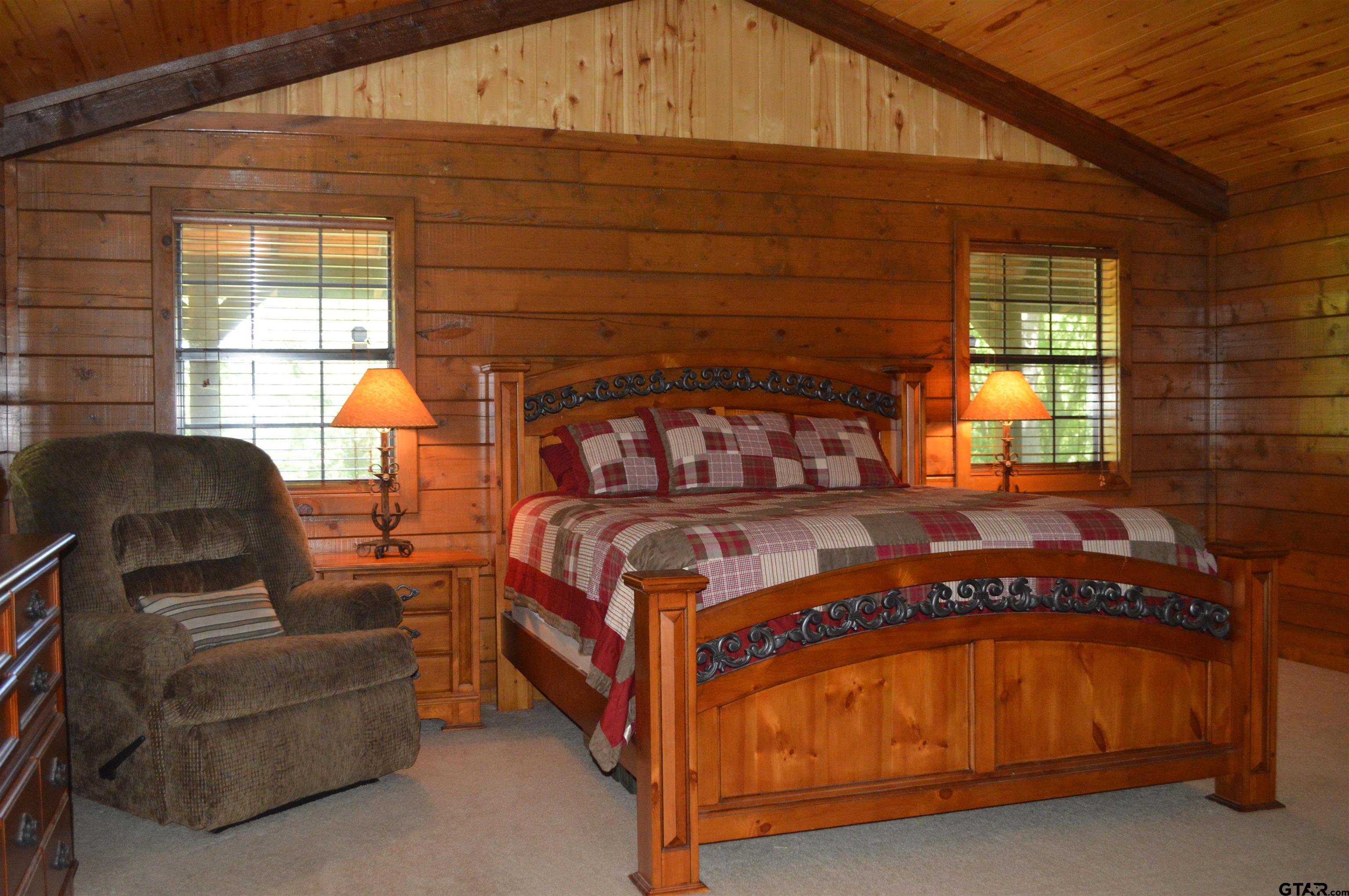 1765 Crabapple Road Gilmer, TX 75645 - Photo 12 of 29 a bedroom with a bed next to a window