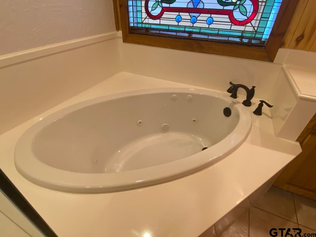 1765 Crabapple Road Gilmer, TX 75645 - Photo 15 of 29 a bathroom with a bathtub