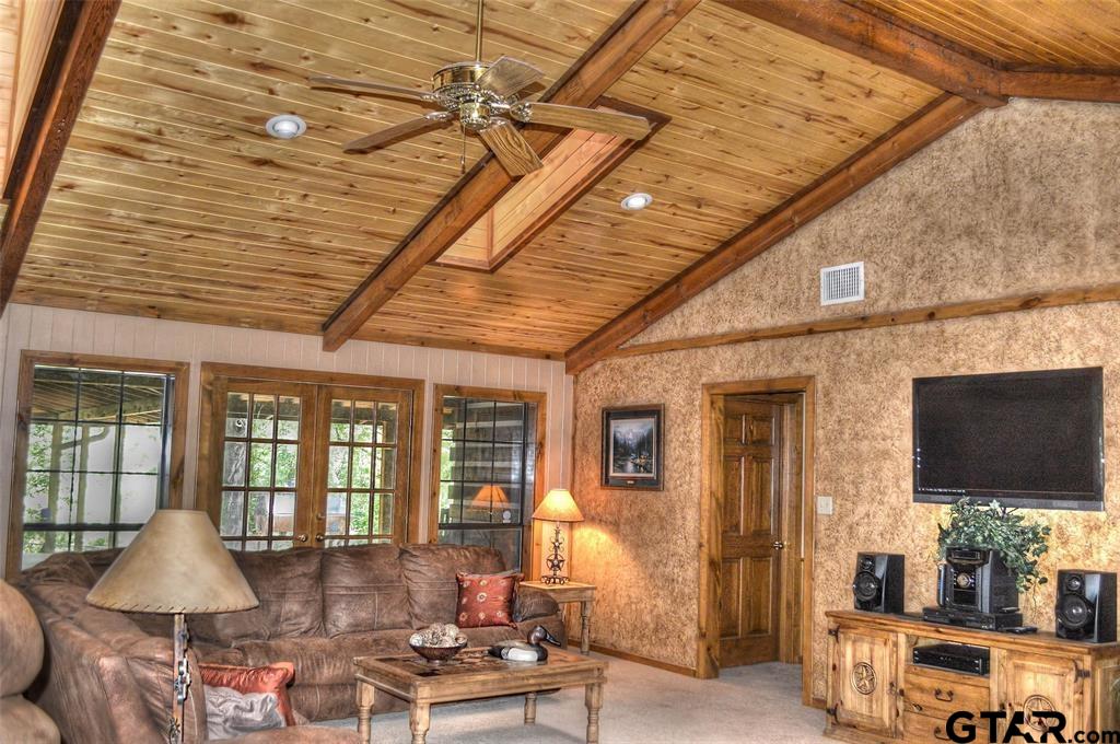 1765 Crabapple Road Gilmer, TX 75645 - Photo 4 of 29 a living room with furniture and a flat screen tv