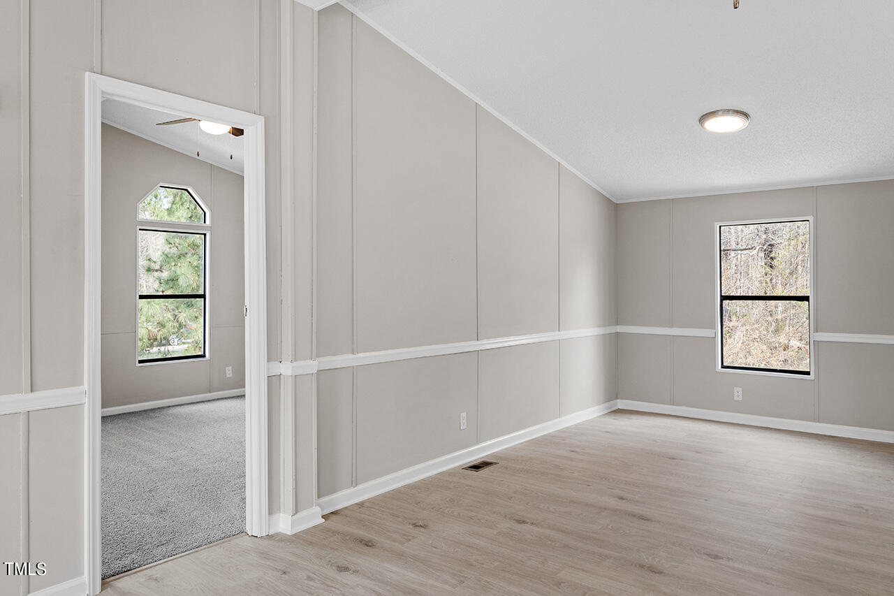 858 Foster Road Henderson, NC 27537 - Photo 19 of 38 an empty room with windows and closet
