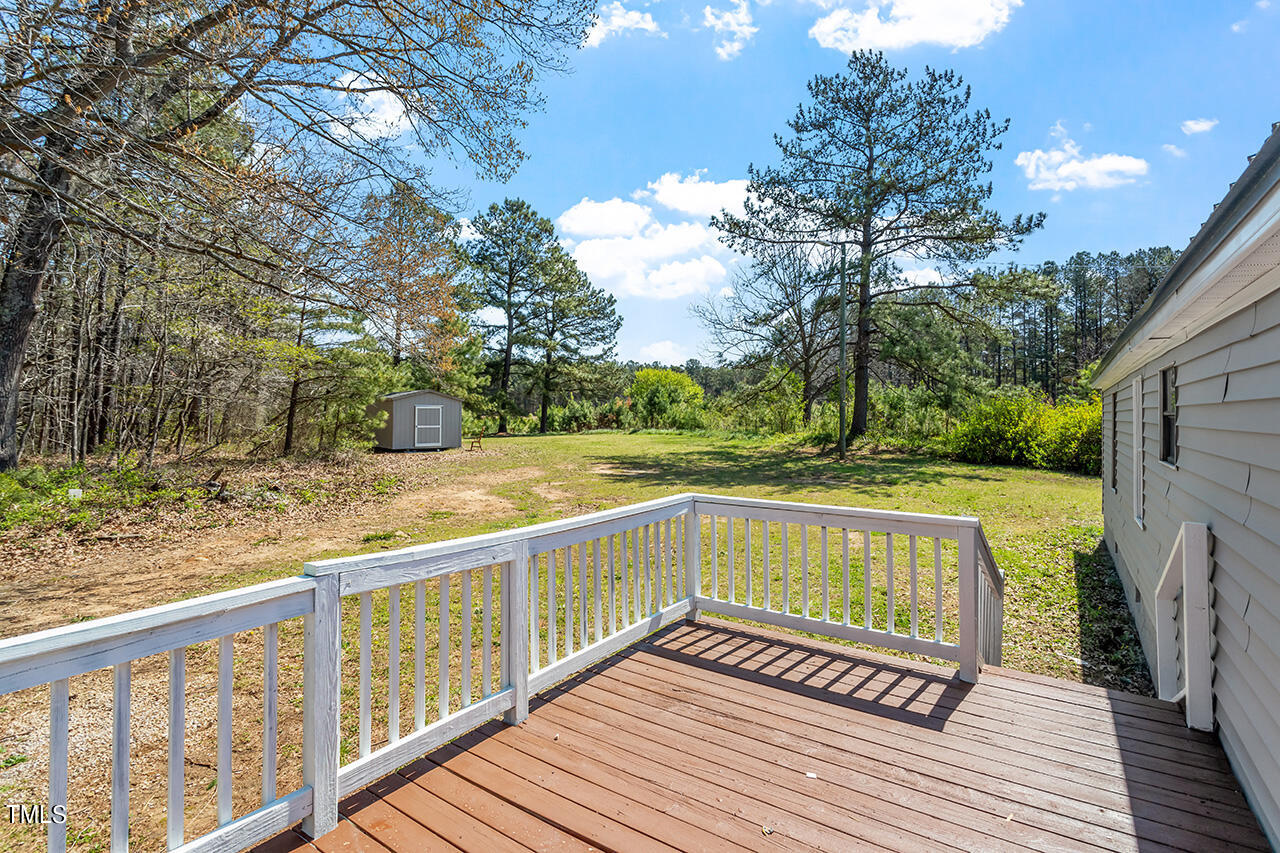 858 Foster Road Henderson, NC 27537 - Photo 37 of 38 a view of balcony with wooden floor and fence