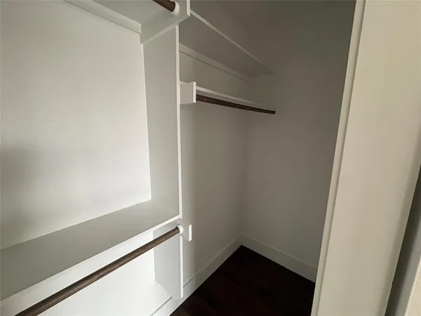 a view of small space with empty racks on the wall