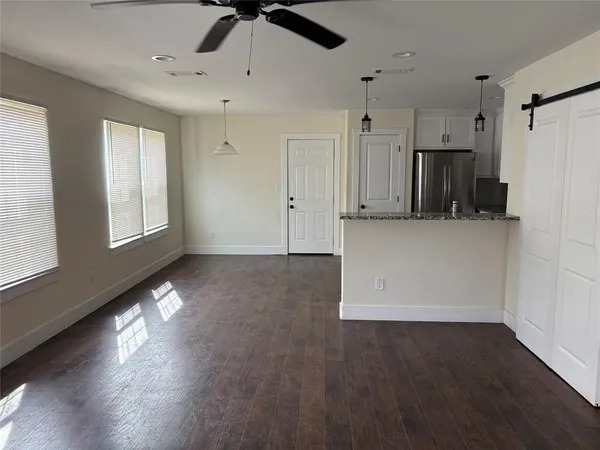 a view of a kitchen with a dishwasher cabinets and wooden floor