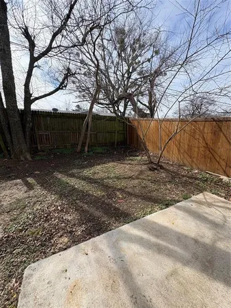 a view of a backyard of the house