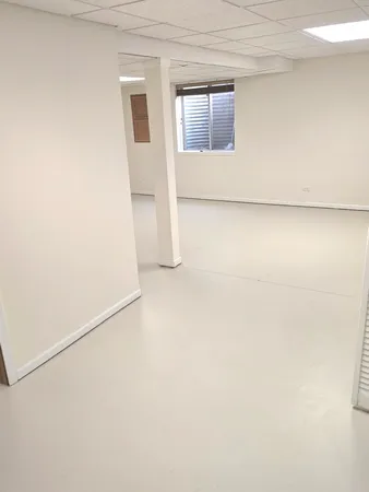 a view of empty room with windows