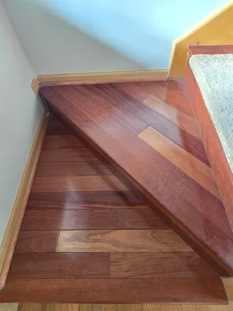 a view of a porch with wooden floor