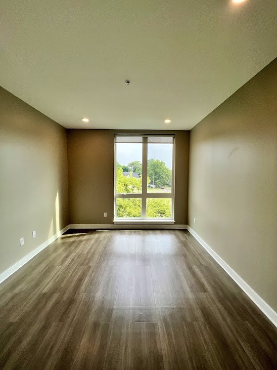 625 South Goodman Street, Unit 311 Rochester, NY 14620 - Photo 12 of 23 View of bedroom 2 with floor to ceiling windows and view of Rochester city skyline
