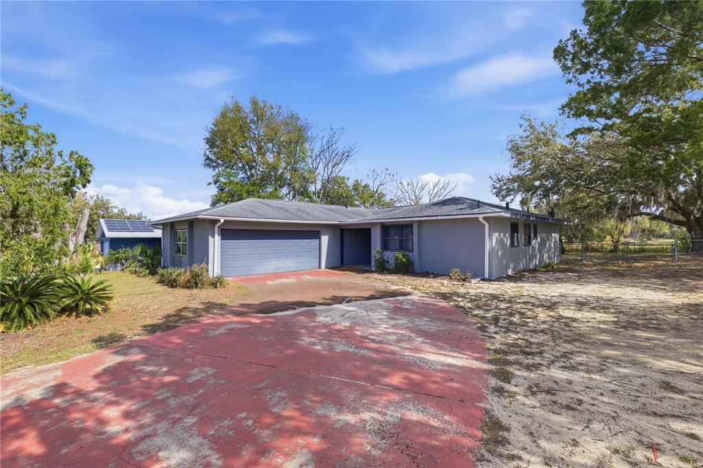 9 Emerald Pass Ocala, FL 34472 - Photo 1 of 1 a front view of a house with a yard and garage
