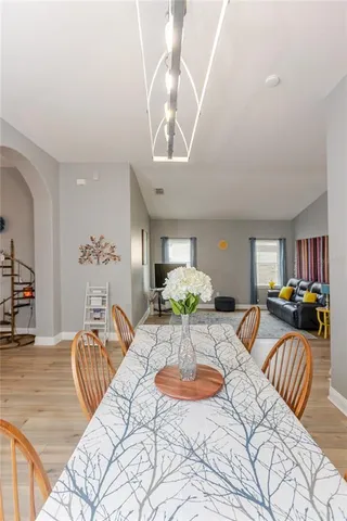 a living room with furniture a rug and a flat screen tv