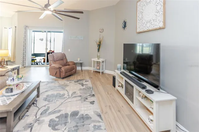 a large kitchen with stainless steel appliances lots of counter space and wooden floor