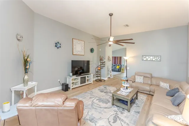 a kitchen with a refrigerator and a stove top oven