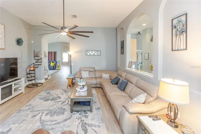 a view of a livingroom with furniture and windows