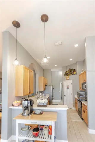 a spacious bathroom with a sink and a mirror