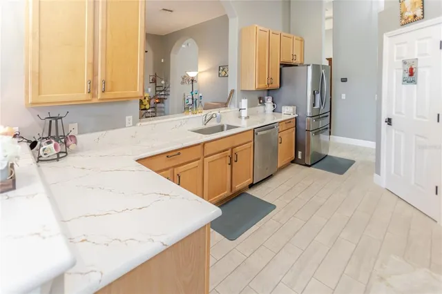 a bathroom with double vanity sink and a mirror