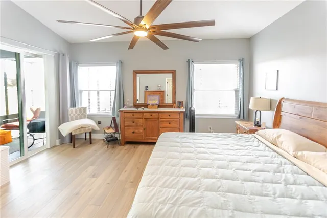 a bedroom with a bed and a couch