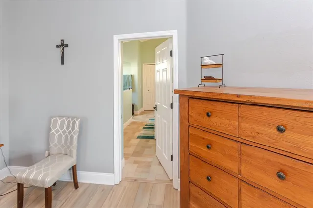 a view of a house with backyard porch and sitting area