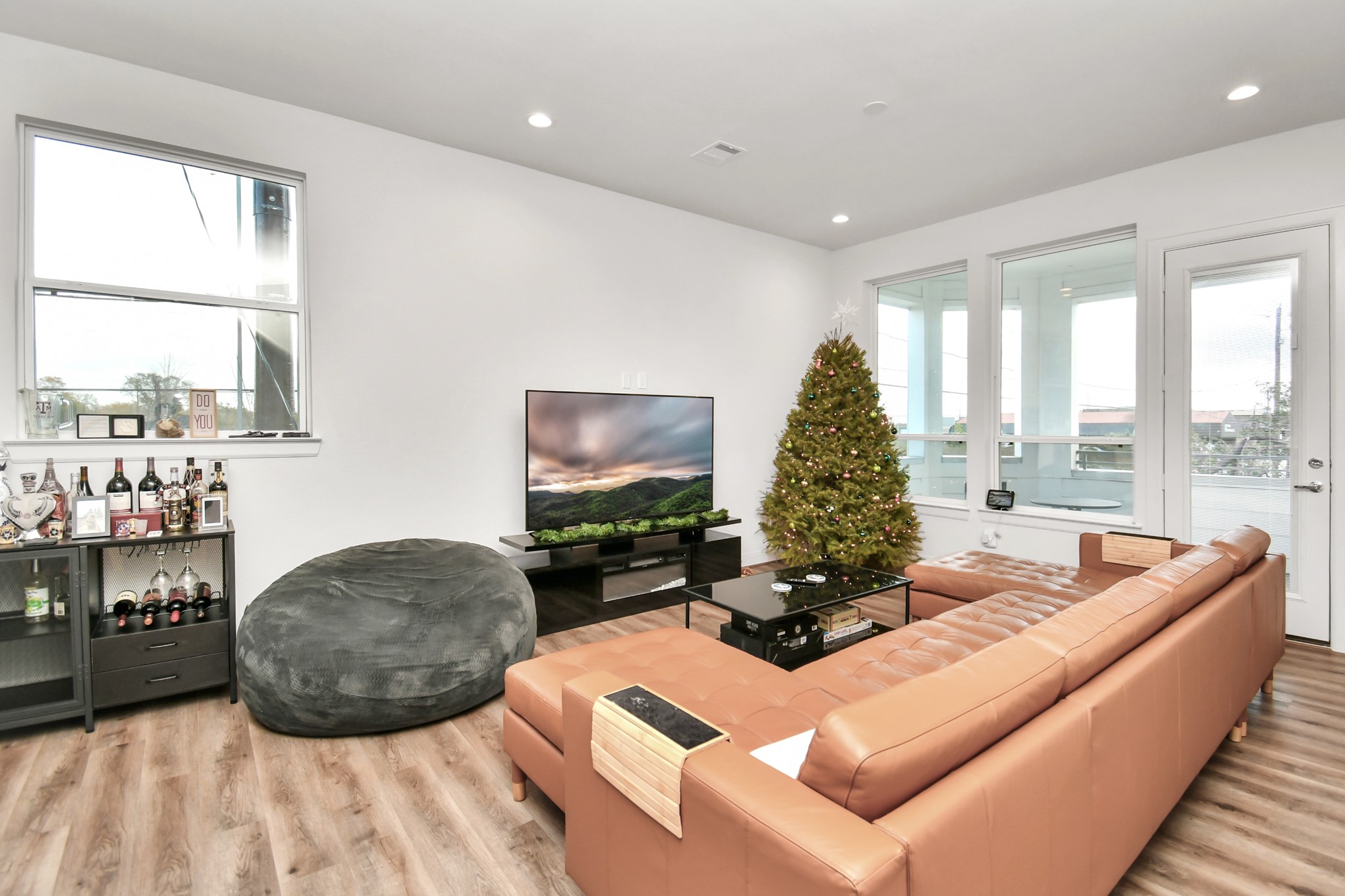 1905 Maury Street, Unit A Houston, TX 77026 - Photo 13 of 44 a living room with furniture and a flat screen tv