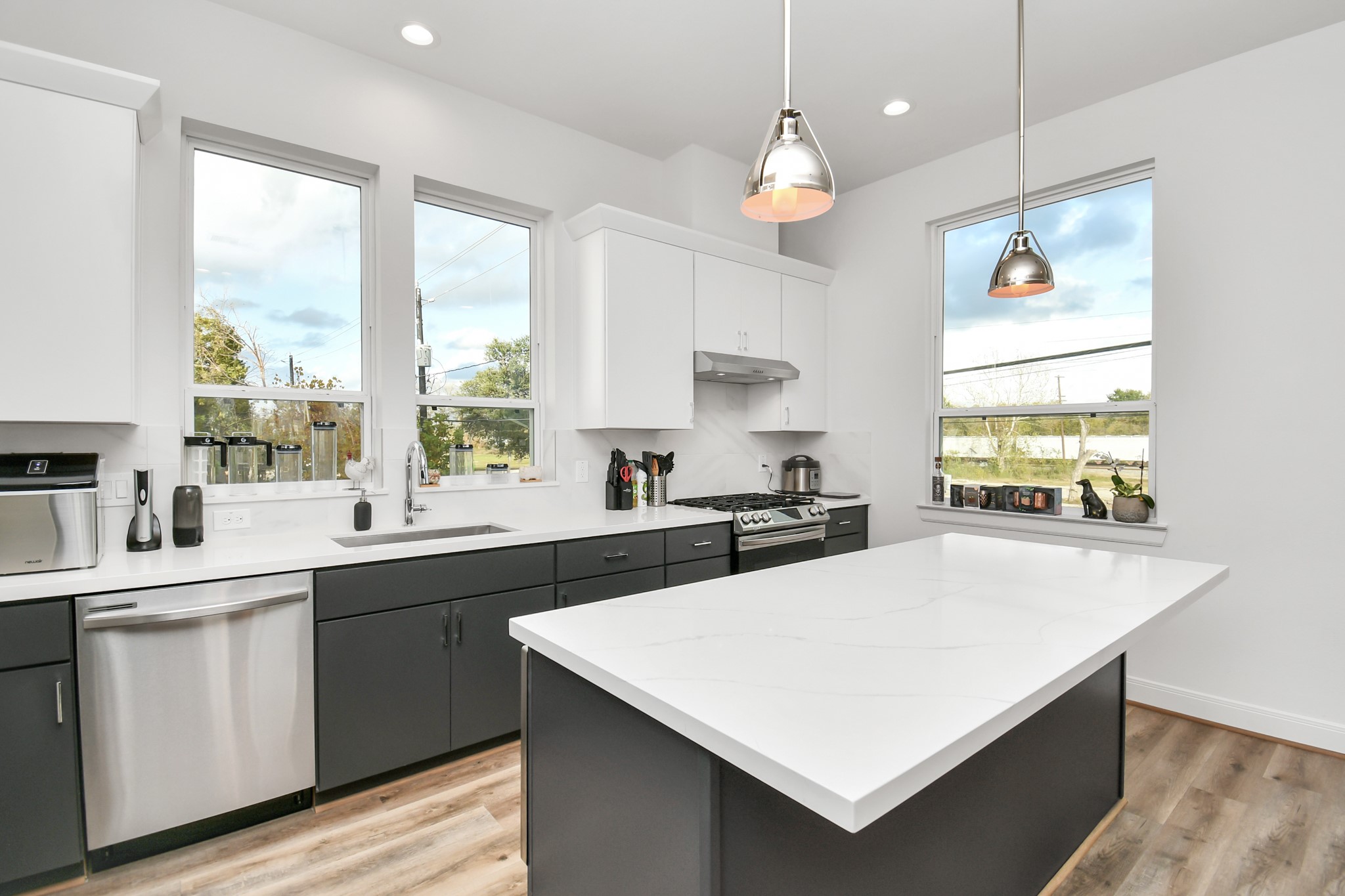 1905 Maury Street, Unit A Houston, TX 77026 - Photo 20 of 44 a kitchen with stainless steel appliances a sink a stove a refrigerator and cabinets