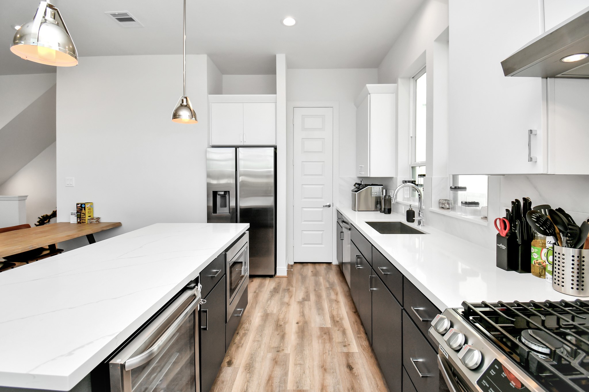 1905 Maury Street, Unit A Houston, TX 77026 - Photo 21 of 44 a kitchen with a sink a stove and cabinets