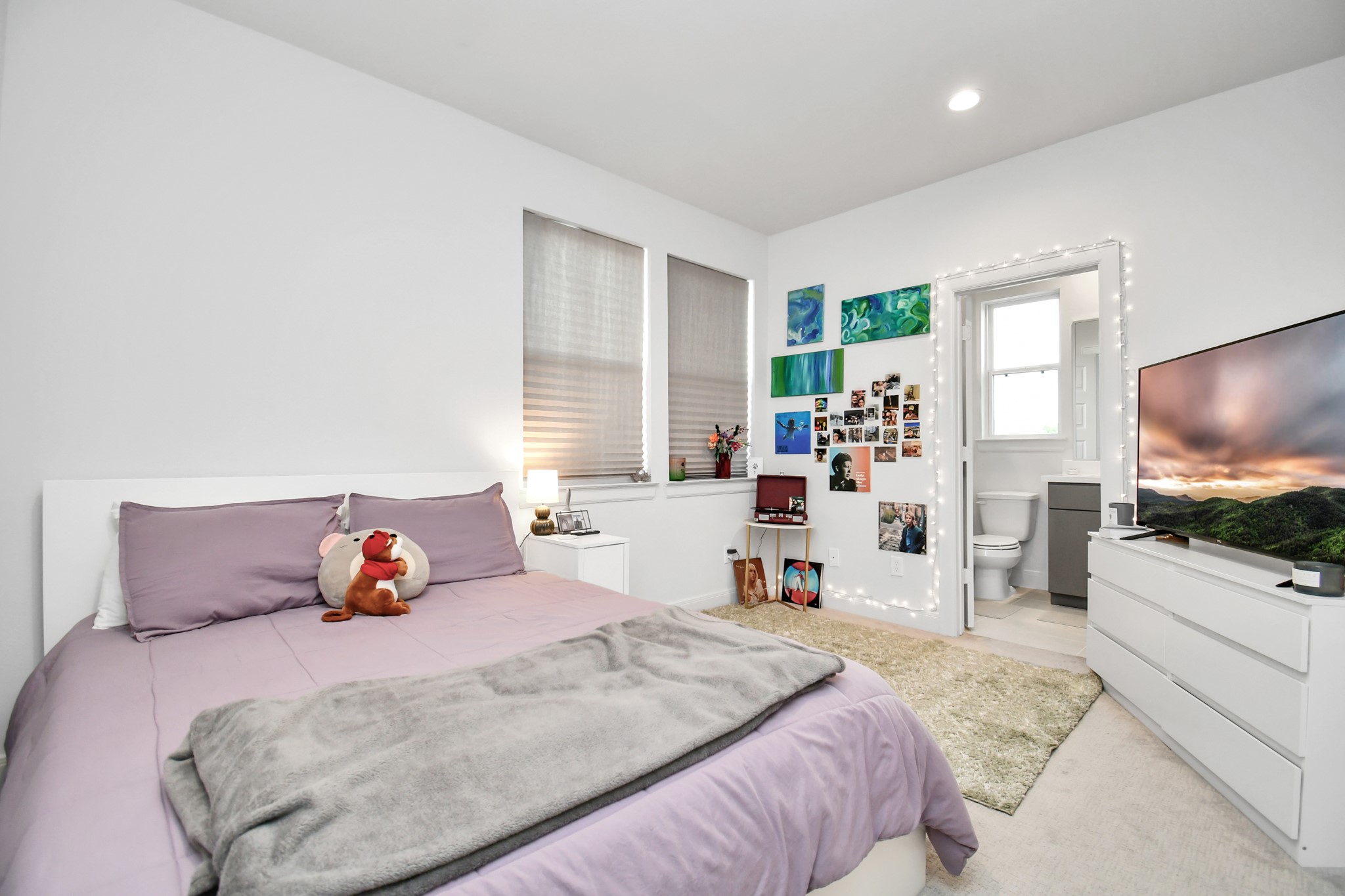 1905 Maury Street, Unit A Houston, TX 77026 - Photo 28 of 44 a bedroom with a bed and a flat screen tv