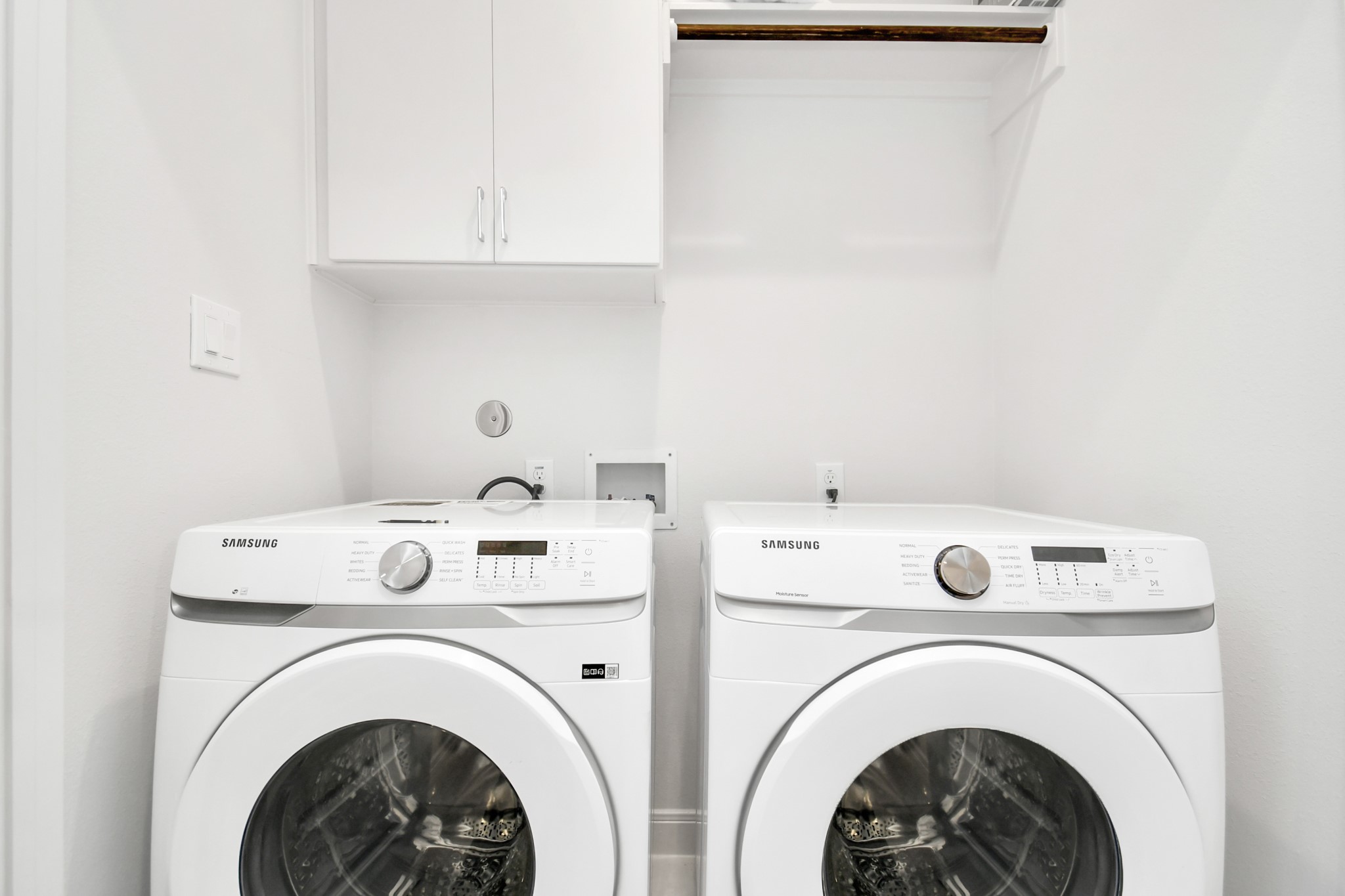 1905 Maury Street, Unit A Houston, TX 77026 - Photo 30 of 44 a view of washer and dryer with kitchen in the background