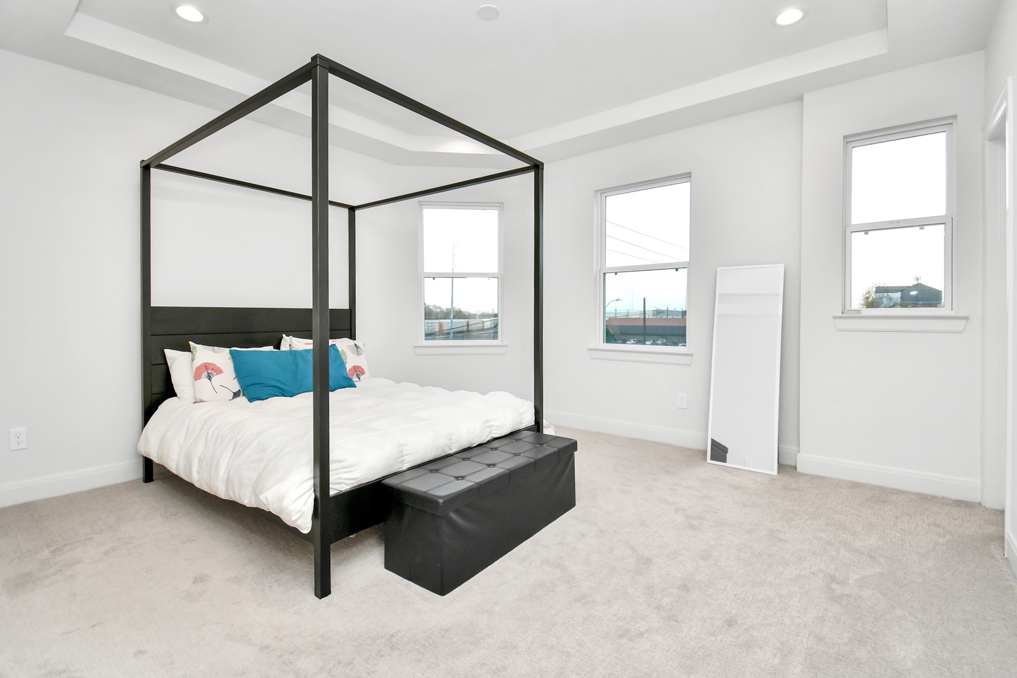 1905 Maury Street, Unit A Houston, TX 77026 - Photo 31 of 44 a bed sitting in a bedroom next to a window