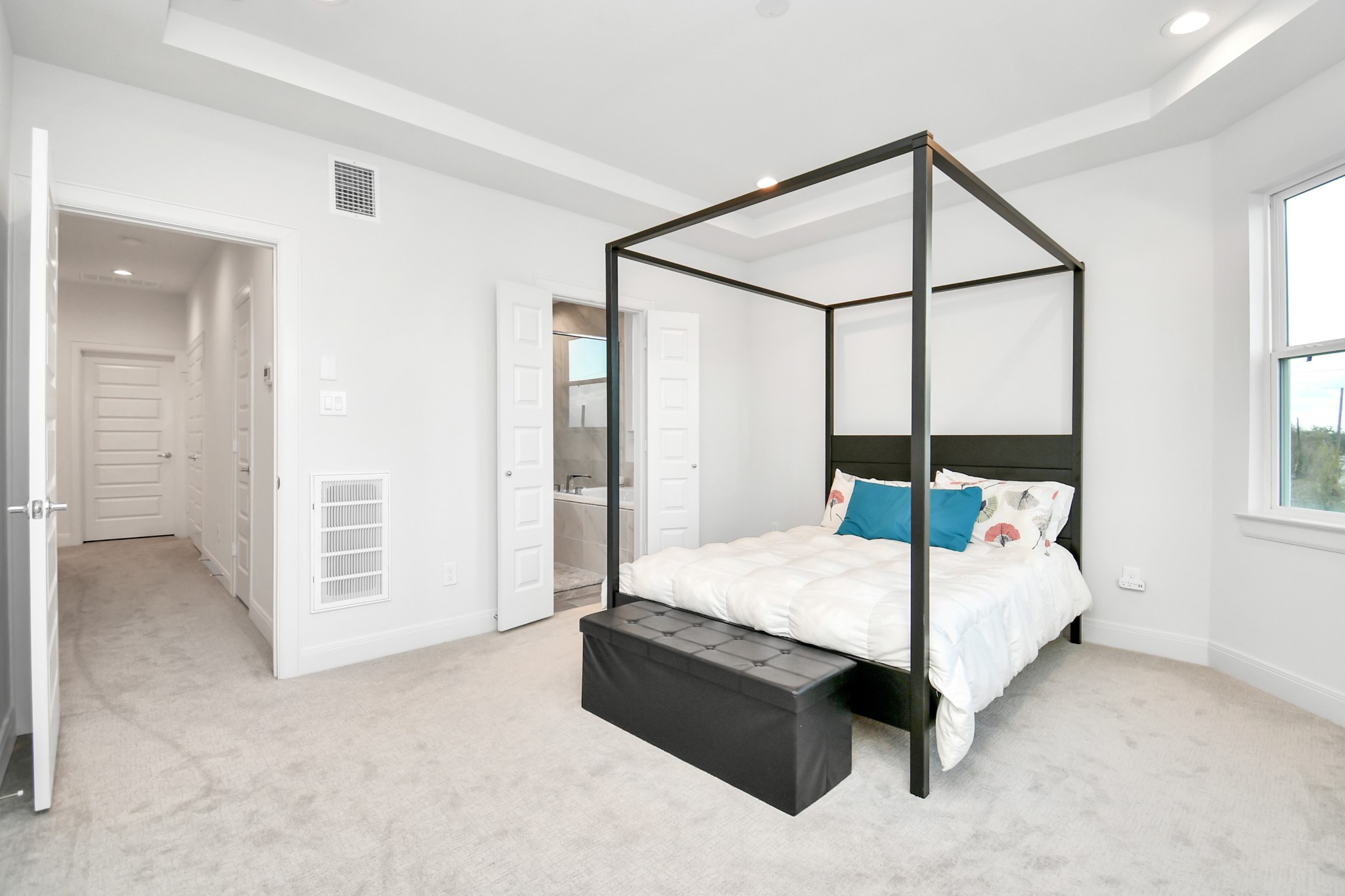 1905 Maury Street, Unit A Houston, TX 77026 - Photo 32 of 44 a bedroom with a bed table and two window