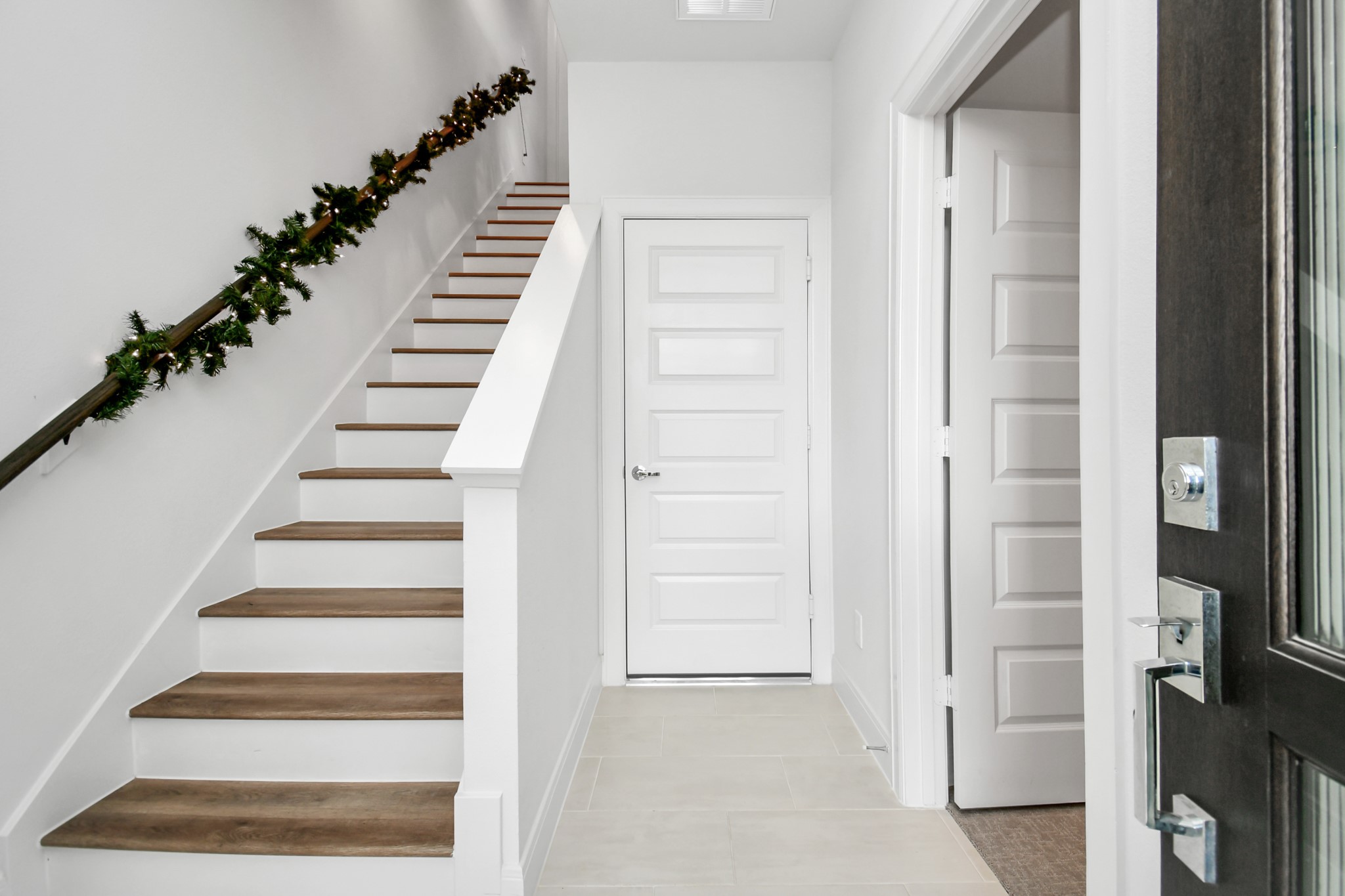 1905 Maury Street, Unit A Houston, TX 77026 - Photo 8 of 44 a view of an entryway with staircase