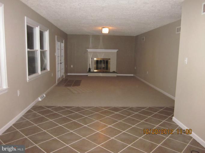 210 Rhett Lane Elkton, MD 21921 - Photo 14 of 25 Great Room, Fireplace, French doors to deck
