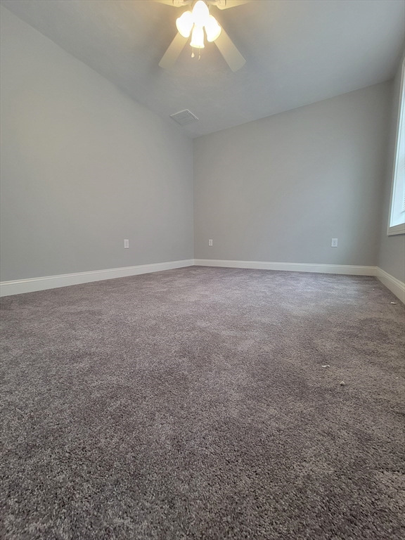 55 Arlington Street, Unit 7 Brockton, MA 02301 - Photo 12 of 37 a view of an empty room and a chandelier fan
