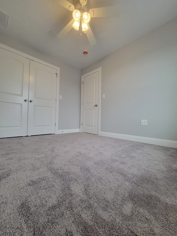 55 Arlington Street, Unit 7 Brockton, MA 02301 - Photo 21 of 37 a view of an empty room and chandelier fan