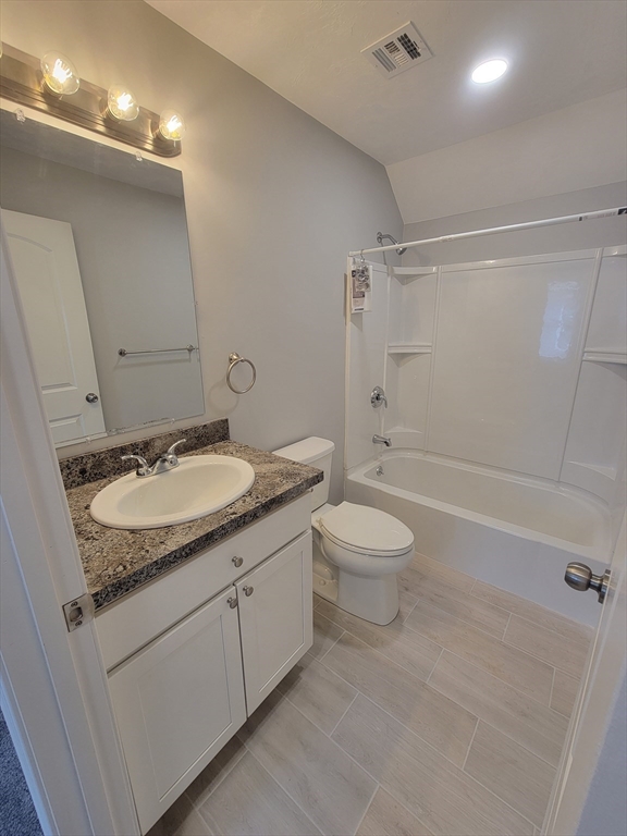 55 Arlington Street, Unit 7 Brockton, MA 02301 - Photo 29 of 37 a bathroom with a granite countertop sink toilet and shower