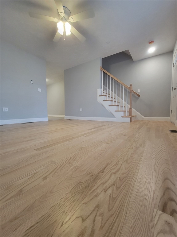 55 Arlington Street, Unit 7 Brockton, MA 02301 - Photo 3 of 37 a view of an empty room with window and wooden floor