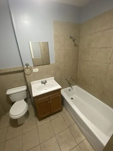 a bathroom with a sink a toilet and a bathtub