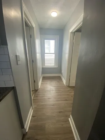 a view of hallway with windows