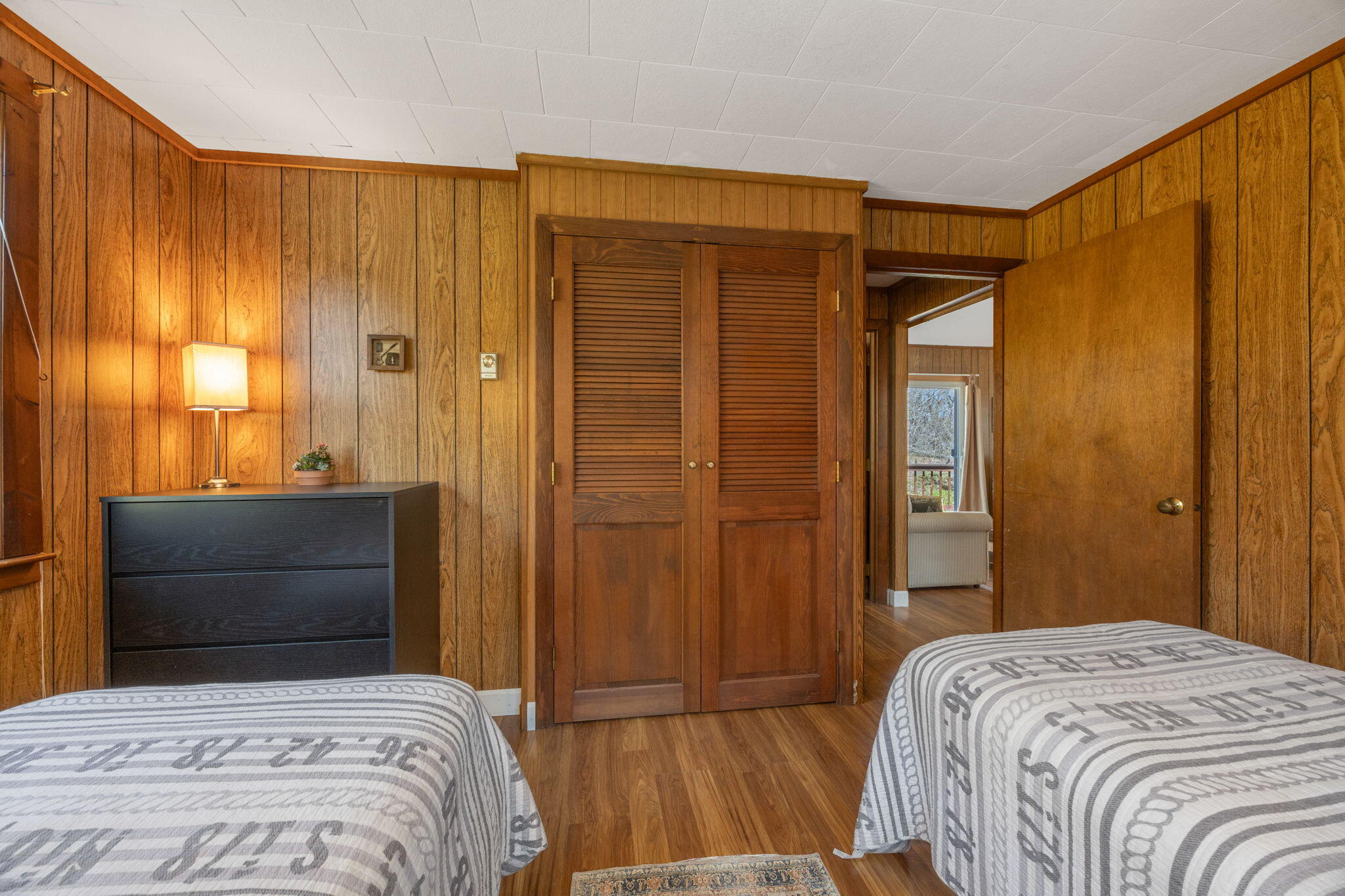 60 Long Avenue, Unit A Wellfleet, MA 02667 - Photo 19 of 28 a bedroom with a bed and a dresser