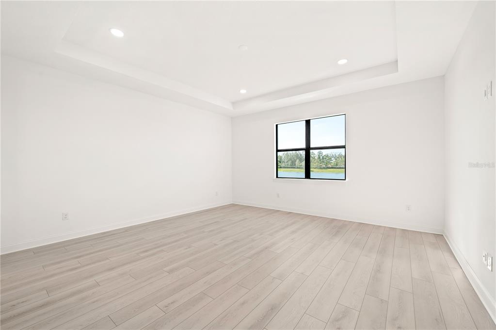 5770 Freestone Circle Apollo Beach, FL 33572 - Photo 17 of 29 an empty room with wooden floor and window