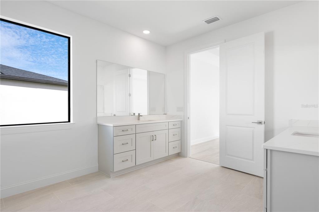 5770 Freestone Circle Apollo Beach, FL 33572 - Photo 19 of 29 a bathroom with a granite countertop sink mirror and a
