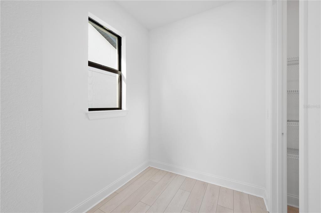 5770 Freestone Circle Apollo Beach, FL 33572 - Photo 22 of 29 a view of a small space with wooden floor and a window