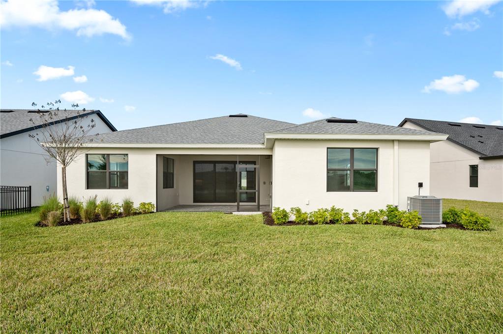 5770 Freestone Circle Apollo Beach, FL 33572 - Photo 26 of 29 a front view of a house with a yard