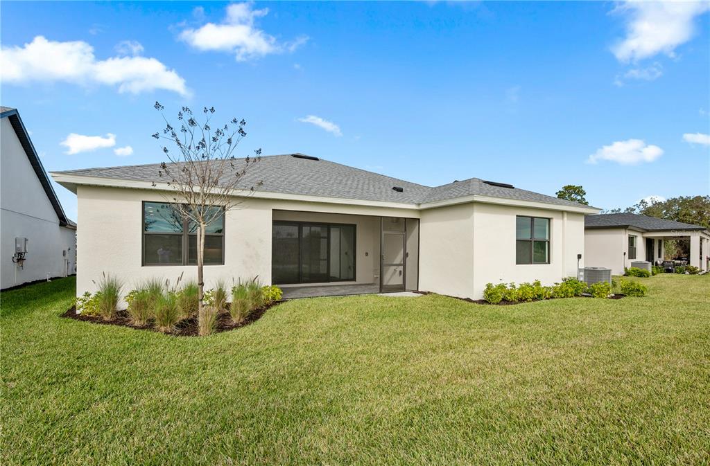 5770 Freestone Circle Apollo Beach, FL 33572 - Photo 27 of 29 a view of a house with a yard