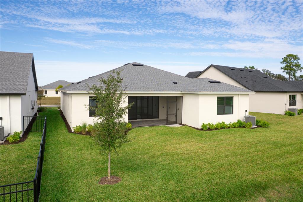 5770 Freestone Circle Apollo Beach, FL 33572 - Photo 5 of 29 a view of a house with a big yard and large trees