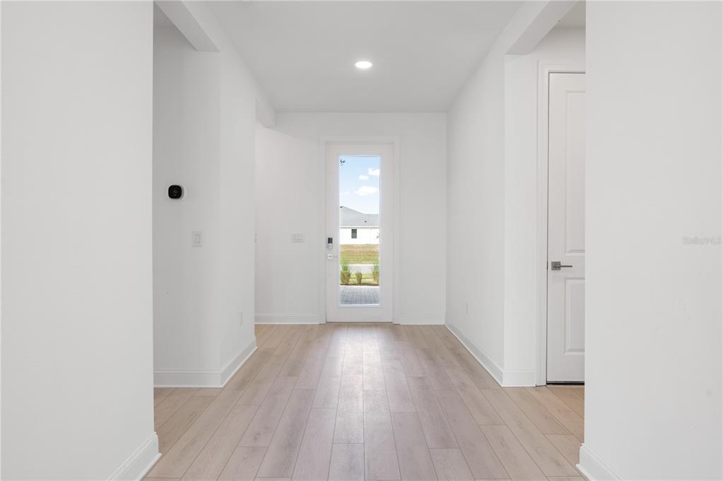 5770 Freestone Circle Apollo Beach, FL 33572 - Photo 7 of 29 a view of empty room with wooden floor and fan